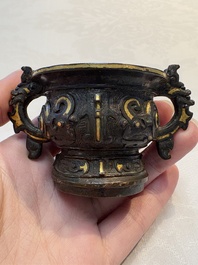 A Chinese archaistic gold and silver-inlaid bronze miniature censer, Ming