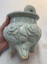 A Chinese qingbai tripod censer with floral relief design, Song/Yuan