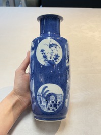 A Chinese blue and white powder-blue-ground 'Zhang Qian Cheng Cha 張騫乘槎' rouleau vase, Kangxi
