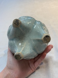 A Chinese qingbai tripod censer with floral relief design, Song/Yuan