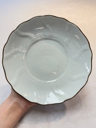 A Chinese moulded white-glazed plate with anhua floral design, Xuande mark, Ming