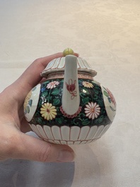 A Chinese famille rose black-ground teapot and stand with floral design, Yongzheng/Qianlong