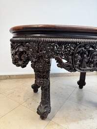 A Chinese finely carved hongmu marble top oval table, Canton, 19th C.