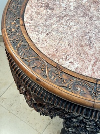 A Chinese finely carved hongmu marble top oval table, Canton, 19th C.