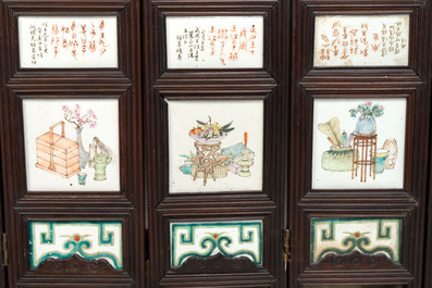 A rare Chinese eight-panel hongmu room divider with 48 qianjiang cai plaques, signed Jia Xingqing 贾醒卿, dated 1902