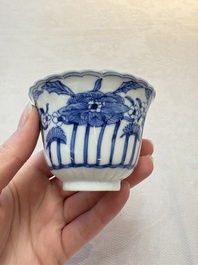 A set of six Chinese blue and white cups and saucers with floral design, Kangxi mark, 19th C.