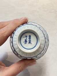 A set of six Chinese blue and white cups and saucers with floral design, Kangxi mark, 19th C.