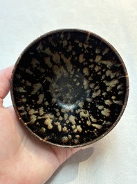 A Chinese Jizhou tortoiseshell-glazed tea bowl, a ewer and a black-glazed vase, Jin and later