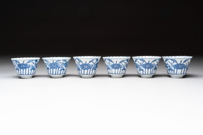 A set of six Chinese blue and white cups and saucers with floral design, Kangxi mark, 19th C.
