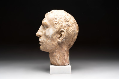 An Italian Grand Tour marble sculpture of a man's head in Roman style, probably after a bust of Caesar, 19th C.
