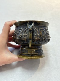 A Chinese archaistic bronze censer with a wooden cover, Xuande mark, 19th C.
