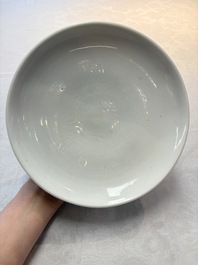 A Chinese Dehua blanc de Chine incised 'peony' plate, 17/18th C.