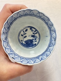A set of six Chinese blue and white cups and saucers with floral design, Kangxi mark, 19th C.