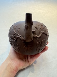 A Chinese Yixing stoneware 'squirrels among grapevines' teapot and cover, Kangxi