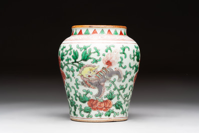 A small Chinese wucai 'Buddhist lion and peony scrolls' jar, Transitional period