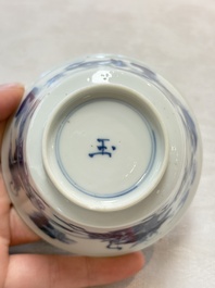 A Chinese blue and white 'Mongolian hunting' cup and saucer, jade mark, Kangxi