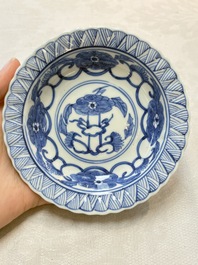 A set of six Chinese blue and white cups and saucers with floral design, Kangxi mark, 19th C.