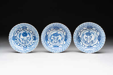 A set of six Chinese blue and white cups and saucers with floral design, Kangxi mark, 19th C.