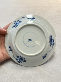 A Chinese blue and white 'Mongolian hunting' cup and saucer, jade mark, Kangxi