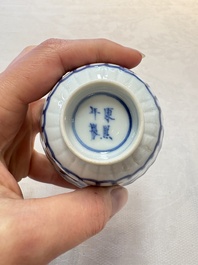 A set of six Chinese blue and white cups and saucers with floral design, Kangxi mark, 19th C.