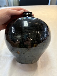 A Chinese Jizhou tortoiseshell-glazed tea bowl, a ewer and a black-glazed vase, Jin and later