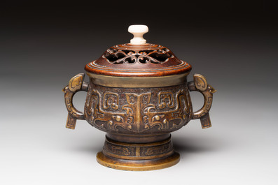 A Chinese archaistic bronze censer with a wooden cover, Xuande mark, 19th C.