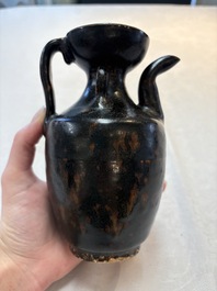 A Chinese Jizhou tortoiseshell-glazed tea bowl, a ewer and a black-glazed vase, Jin and later