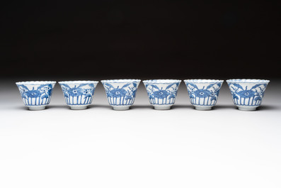 A set of six Chinese blue and white cups and saucers with floral design, Kangxi mark, 19th C.