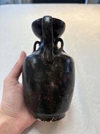 A Chinese Jizhou tortoiseshell-glazed tea bowl, a ewer and a black-glazed vase, Jin and later