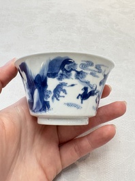 A Chinese blue and white 'Mongolian hunting' cup and saucer, jade mark, Kangxi