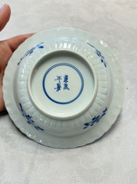 A set of six Chinese blue and white cups and saucers with floral design, Kangxi mark, 19th C.