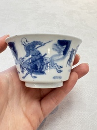 A Chinese blue and white 'Mongolian hunting' cup and saucer, jade mark, Kangxi