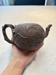 A Chinese Yixing stoneware 'squirrels among grapevines' teapot and cover, Kangxi