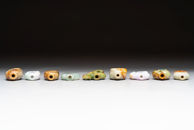 A group of nine Chinese jadeite snuff bottles, 20th C.