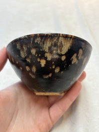A Chinese Jizhou tortoiseshell-glazed tea bowl, a ewer and a black-glazed vase, Jin and later