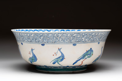A large polychrome Iznik-style 'peacocks' bowl on a wooden stand, Samson, Paris, 19th C.