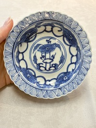 A set of six Chinese blue and white cups and saucers with floral design, Kangxi mark, 19th C.