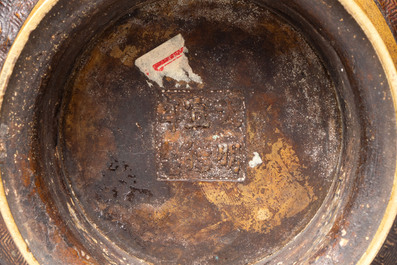 A Chinese archaistic bronze censer with a wooden cover, Xuande mark, 19th C.