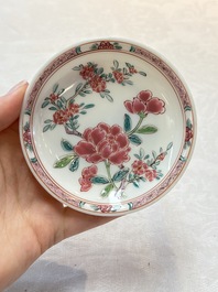 A set of six Chinese famille rose 'peonies' cups and saucers, Yongzheng/Qianlong