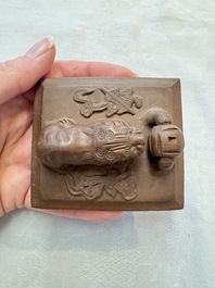 A Chinese Yixing stoneware 'lion and brocade ball' teapot and cover, Qianlong