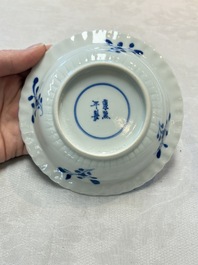 A set of six Chinese blue and white cups and saucers with floral design, Kangxi mark, 19th C.