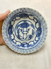 A set of six Chinese blue and white cups and saucers with floral design, Kangxi mark, 19th C.