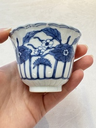 A set of six Chinese blue and white cups and saucers with floral design, Kangxi mark, 19th C.