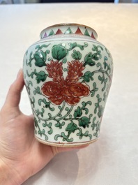 A small Chinese wucai 'Buddhist lion and peony scrolls' jar, Transitional period