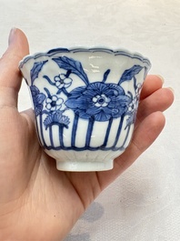 A set of six Chinese blue and white cups and saucers with floral design, Kangxi mark, 19th C.