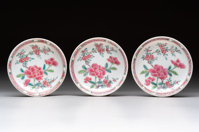 A set of six Chinese famille rose 'peonies' cups and saucers, Yongzheng/Qianlong
