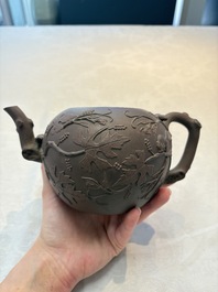 A Chinese Yixing stoneware 'squirrels among grapevines' teapot and cover, Kangxi