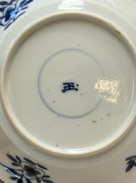 A Chinese blue and white 'Mongolian hunting' cup and saucer, jade mark, Kangxi