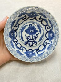 A set of six Chinese blue and white cups and saucers with floral design, Kangxi mark, 19th C.