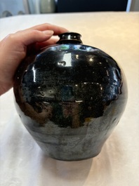 A Chinese Jizhou tortoiseshell-glazed tea bowl, a ewer and a black-glazed vase, Jin and later